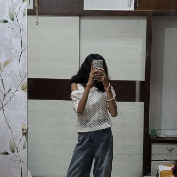 Contemporary casual look highlighting styling sense and natural posing.